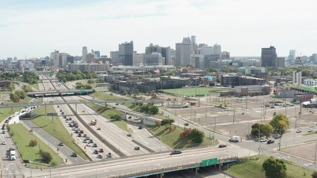 Wide shot of Detroit, Michigan skyline with traffic on Fisher Freeway with stable video.