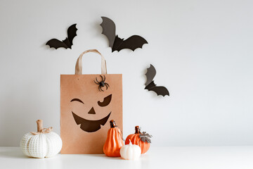 Halloween pumpkins, bats and shopping bag. Happy halloween concept.