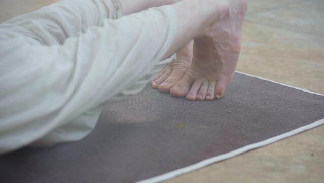 Close up of feet in yoga posture