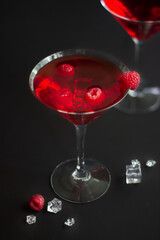 Red alcohol raspberry cocktails in martini glass. Selective focus.