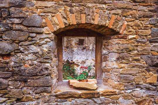 Window with flowers, medieval castle Zborov, Slovakia. Autumn time