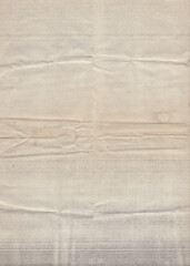 Old vintage rough crumpled paper with scratches and stains texture