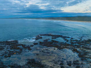 Sunrise with clouds and rocks