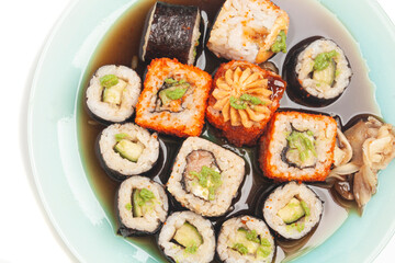 Sushi rolls japanese food on a plate top view