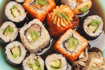 Sushi rolls japanese food on a plate top view