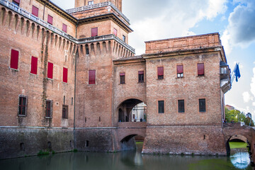 wide-angle close-up of the brick building of the Castle d'Este in Ferrara