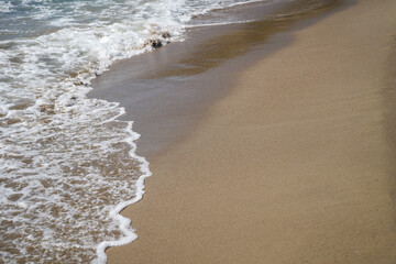 Bubbles waves on the beach texture background      