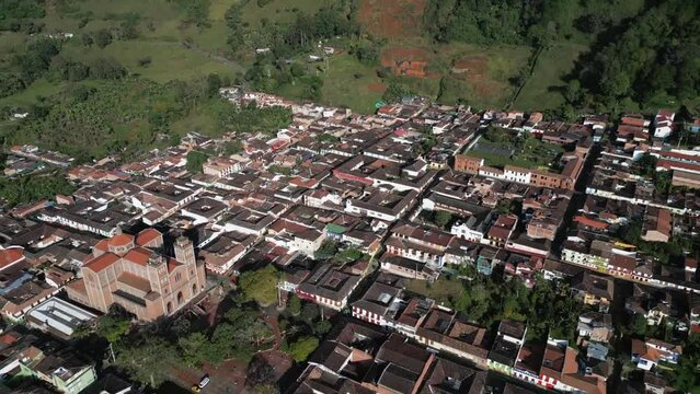 Zoom Out Jerico Town Colombian Deparment of Antioquia Medellin Aerial Drone Fly Out of The Catholic Pueblo Urban Church Zone into Wilderness