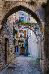Fototapeta na wymiar View on the narrow medieval street of Viviers old town in the South of France (Ardeche)