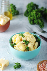 A bowl with Italian dumplings - tortellini