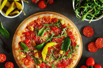 Pizza diavolo flat lay with pepper