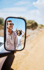 Couple on road trip, smile in car mirror reflection and happy smile with love on desert holiday...