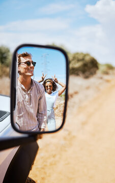 Couple On Road Trip, Smile In Car Mirror Reflection And Happy Smile With Love On Desert Holiday Road Trip Drive In South Africa. Summer Vacation In The Wild, Diverse Male And Female Friends With Fun