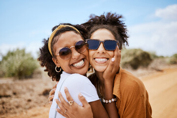 Couple travel portrait, Dubai desert with summer sunglasses or care free tourism road trip together. Happy black women friends in outdoor vacation, smile on faces in natural sandy street on adventure
