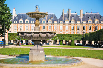 Garden & fountain in wonderful and very elegant Place des Vosges, Paris