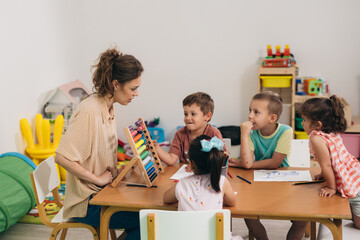 teacher teaching children in daycare
