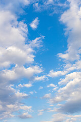 beautiful blue sky with clouds. vertical frame