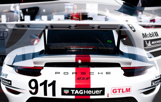 Porsche car RSR in double exposition, with with a red stripe.