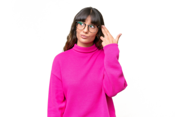 Young caucasian woman over isolated background with problems making suicide gesture