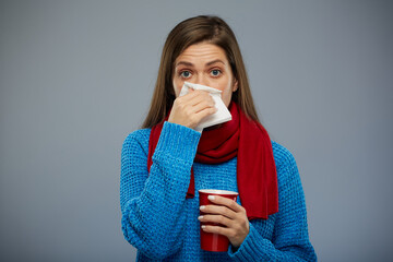 Sick woman blows her nose in a napkin. isolated portrait