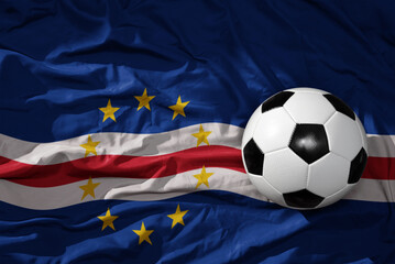 vintage football ball on the waveing national flag of cape verde background. 3D illustration