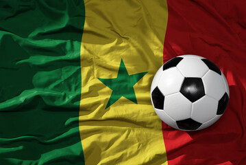vintage football ball on the waveing national flag of senegal background. 3D illustration