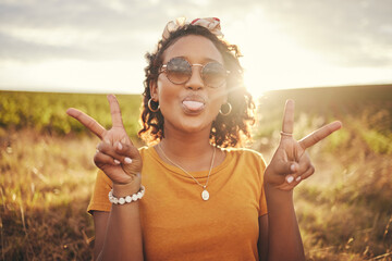 Nature, freedom and peace hand sign by woman at sunset in the countryside, happy and content while traveling, Portrait, grass and black woman having fun on road trip, taking break in rural landscape