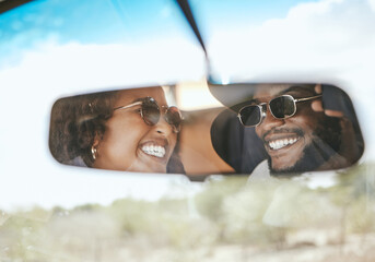 Road trip, travel and black couple happy about a holiday in a car mirror reflection together....