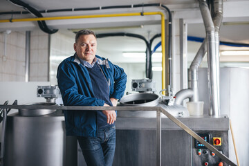 Craft brewery owner smiling portrait