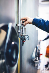 Working with brewery equipment producing craft beer