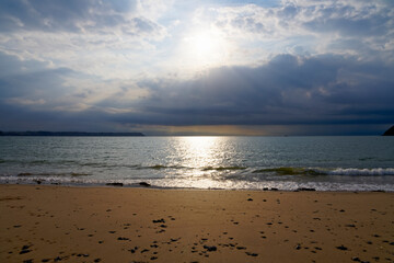 Darkening skies begin to obscure the summer sun in Oxwich Bay.