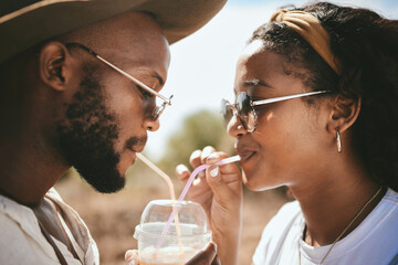 Outdoor couple sharing straw drink, summer date and sunshine vacation together in Brazil. Young black people face, love and happiness to share drinking romance, relax and holiday fun in garden park