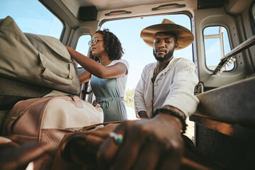 Travel luggage, black couple and car road trip together love bonding on nature safari holiday in...