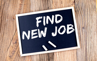 FIND NEW JOB text on chalkboard on the wooden background