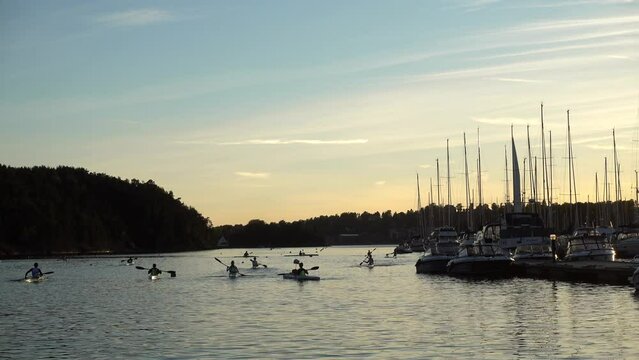 Unidentified people practicing kayaking and canoeing at Bestumkilen Bay in Oslo, Norway.