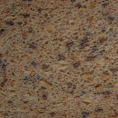 Single piece of rough bread with corns as background with copy space for text. Concept of simple but basic food
