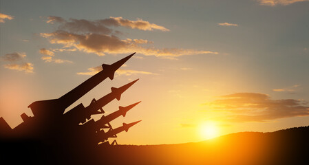The missiles are aimed to the sky at sunset. Nuclear bomb, chemical weapons, missile defense, a system of salvo fire.