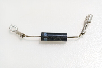 High-voltage diode on a white background. Microwave oven detail.