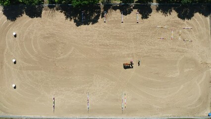 Top Down Aerial View Of Horse Rider Walking Horse In Arena On Ranch, 4K