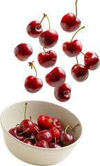 Cherries falling into a bowl