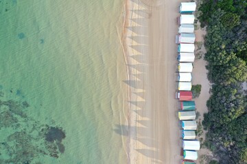 Blue green ocean and small houses