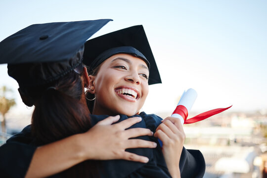 Graduation, education and hug with woman student friends hugging on university campus in celebration of success or qualification. College, graduate and scholarship with a female and friend embracing