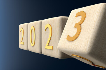 Wooden cube turns from 2022 to 2023 on blue background. 3D Illustration. Close up. New year concept.