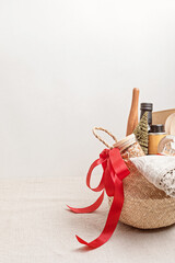 Refined Christmas gift basket for culinary enthusiats with bottle of oil, vinegar and kitchen...