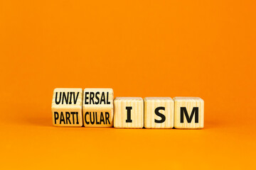 Universalism or particularism symbol. Concept words Universalism or Particularism on cubes. Beautiful orange table orange background. Business universalism or particularism concept. Copy space.