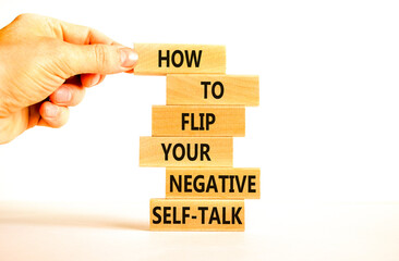 Flip negative self-talk symbol. Concept words How to flip your negative self-talk on wooden blocks. Psychologist hand. Beautiful white background. Psychological negative self-talk concept. Copy space