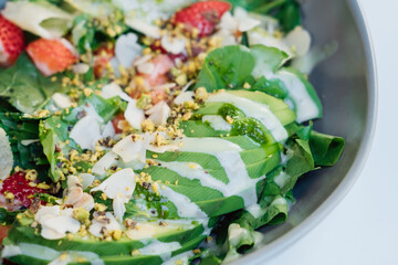 Ecological food. Fresh salad of greens, vegetables and berries. Meat substitute in food.