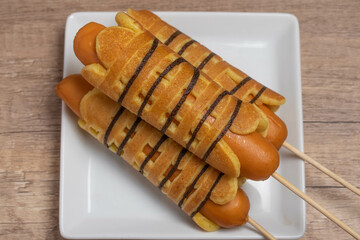 Breakfast sausage wrapped pancakes in a plate