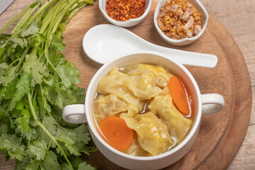 Shrimp dumplings in clear broth and dumplings on table, Chinese wonton dumpling