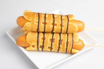 Breakfast sausage wrapped pancakes in a plate